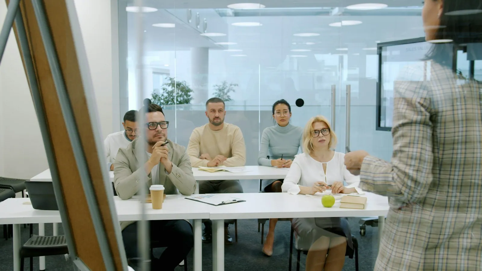 A team attending a presentation in a modern workplace