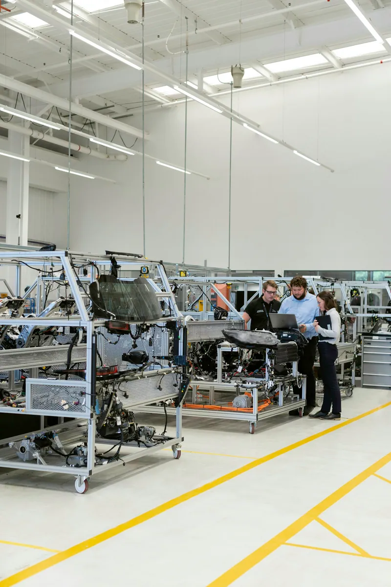 An engineering team testing vehicle electronics and software