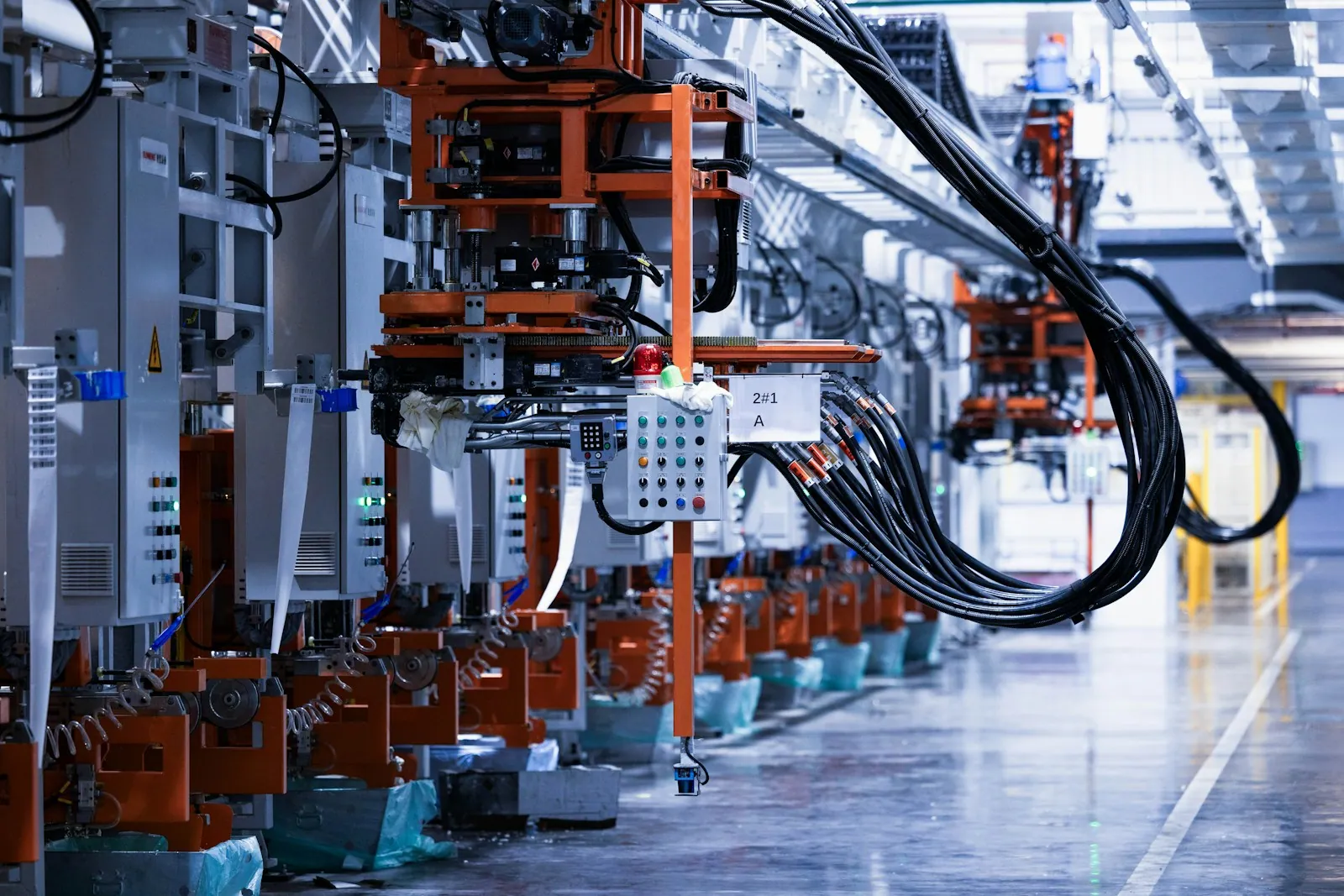 A row of industrial production machines and connected equipment